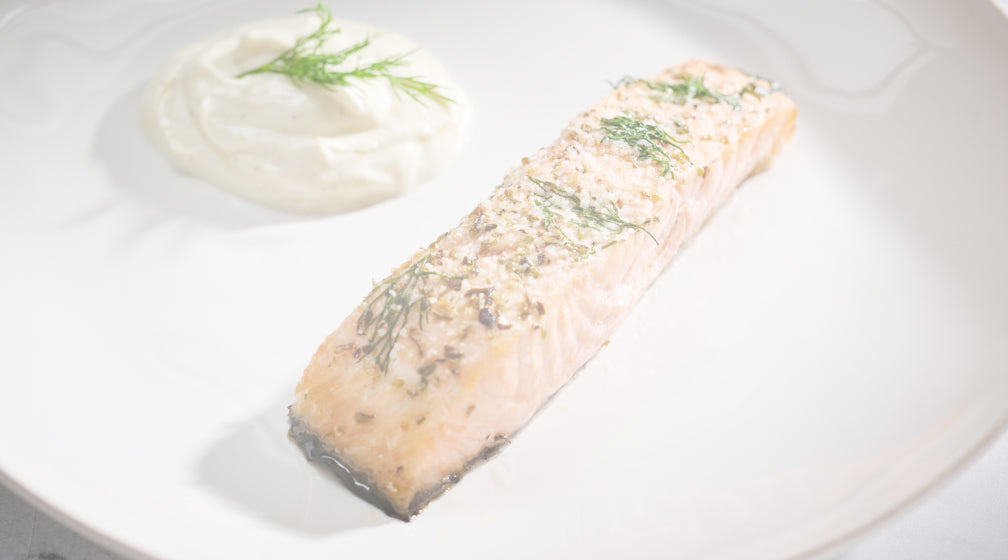 Photo showing a healthy fish meal. Food is medicine, and we offer meal plans to support your plastic surgery recovery.