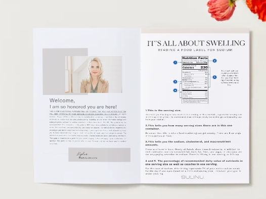 An open magazine on a light surface shows the SWELLING Guide cover with a blonde woman's photo and an article on reducing swelling after surgery with low-sodium meals, titled "How to avoid swell hell and still love your meals." Orange flowers accent the corner.
