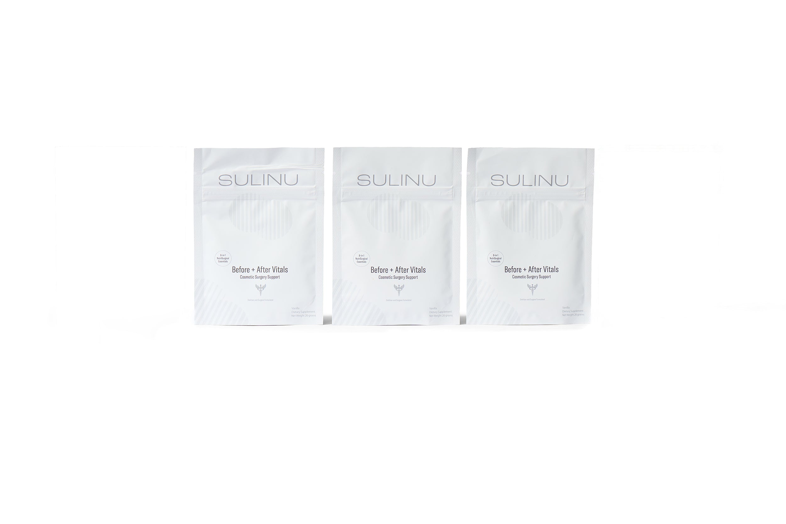 Three white pouches of The VIP Surgical Recovery Kit labeled Before – After Vitals stand upright against a white background. This minimalist supplement packaging with light grey accents is perfect for any cosmetic or surgical recovery kit.
