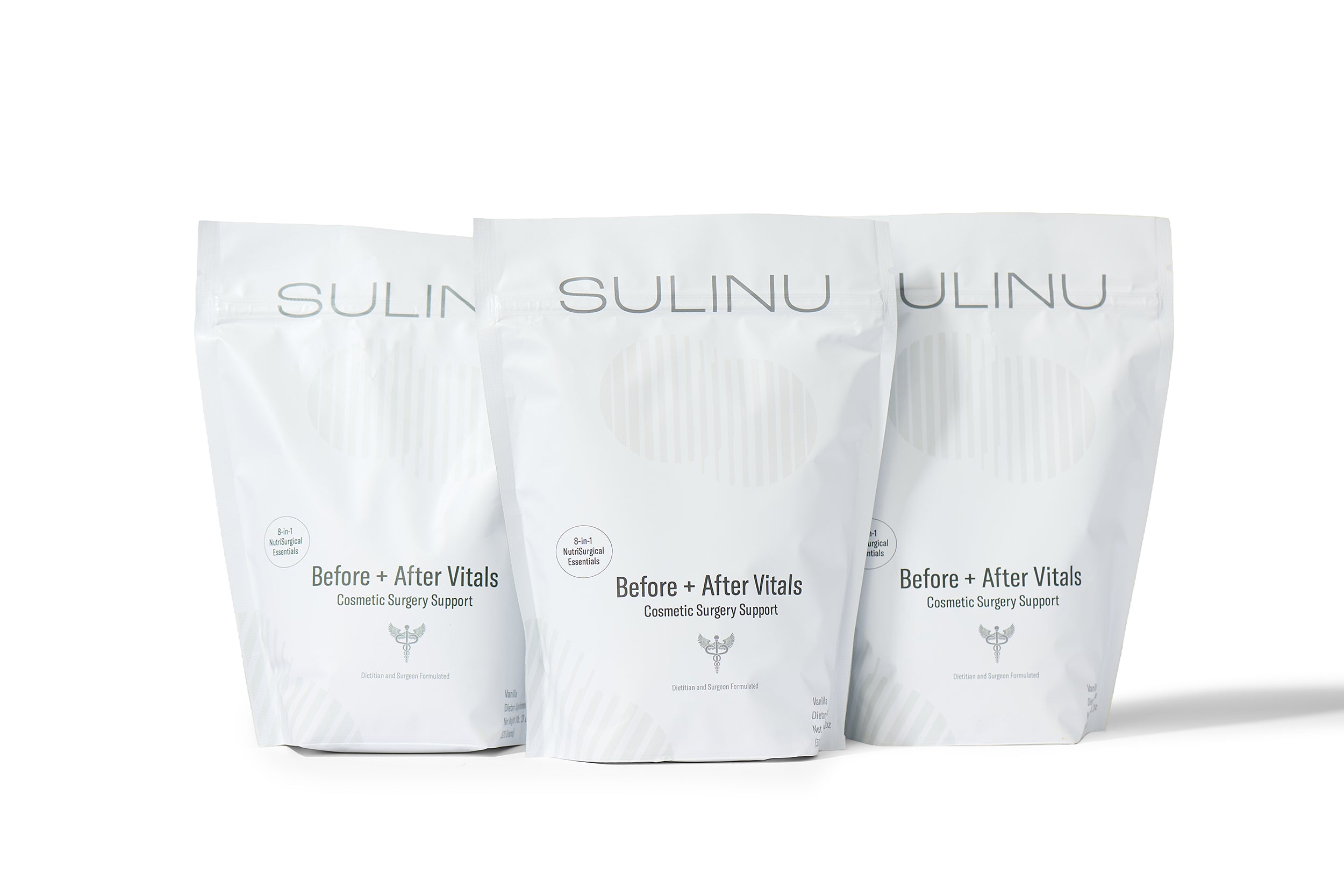Three white resealable pouches labeled The VIP Surgical Recovery Kit stand upright in a row against a white background, designed to support your cosmetic surgery recovery journey.