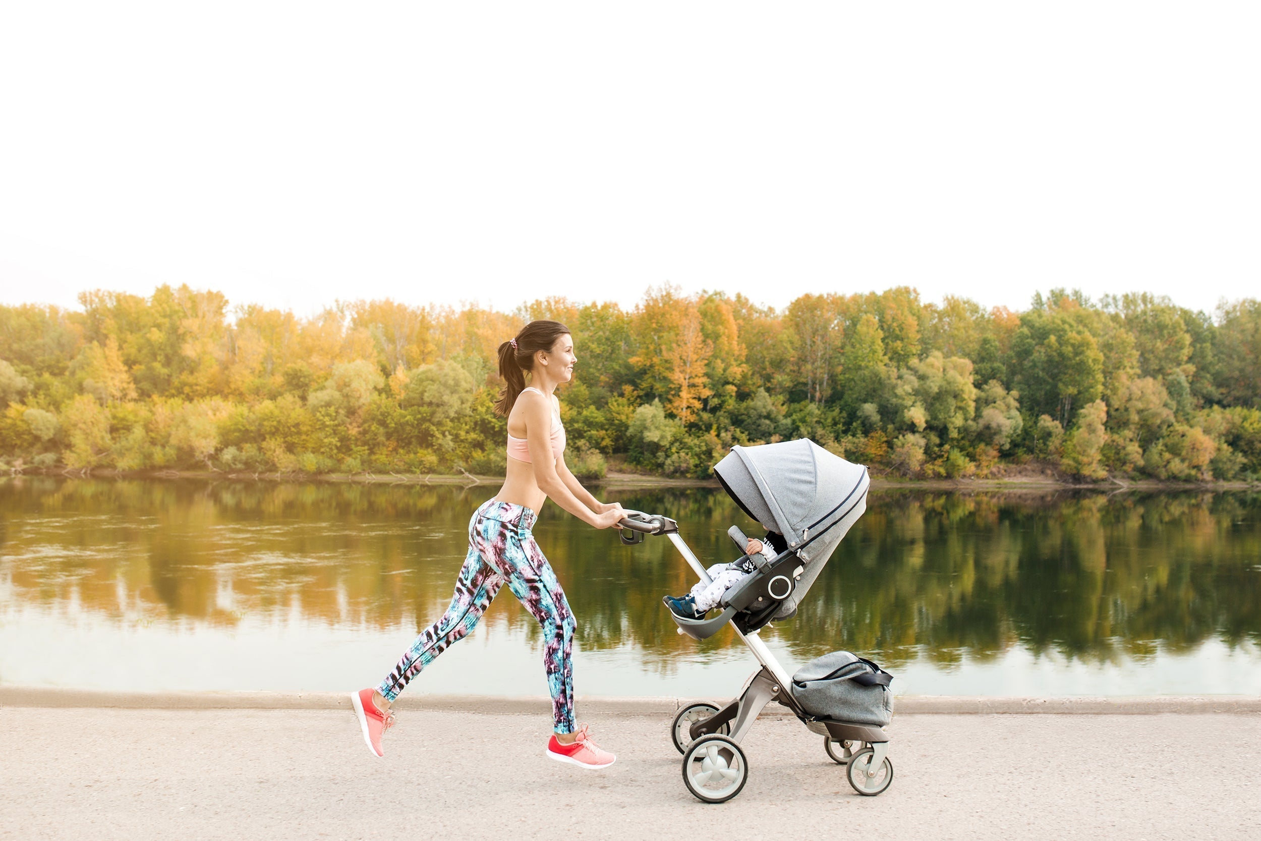 A fit mom pushing a stroller. Mommy Makeover scars vary by procedure and incision site. Learn healing timelines, what affects outcomes, and how to minimize scarring safely.