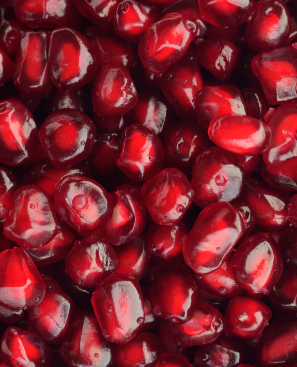 A detail photo of pomegranate arils. Before + After Vitals are the best supplements to support plastic surgery, including essential vitamins to promote tissue repair, reduce inflammation, and boost immune function.