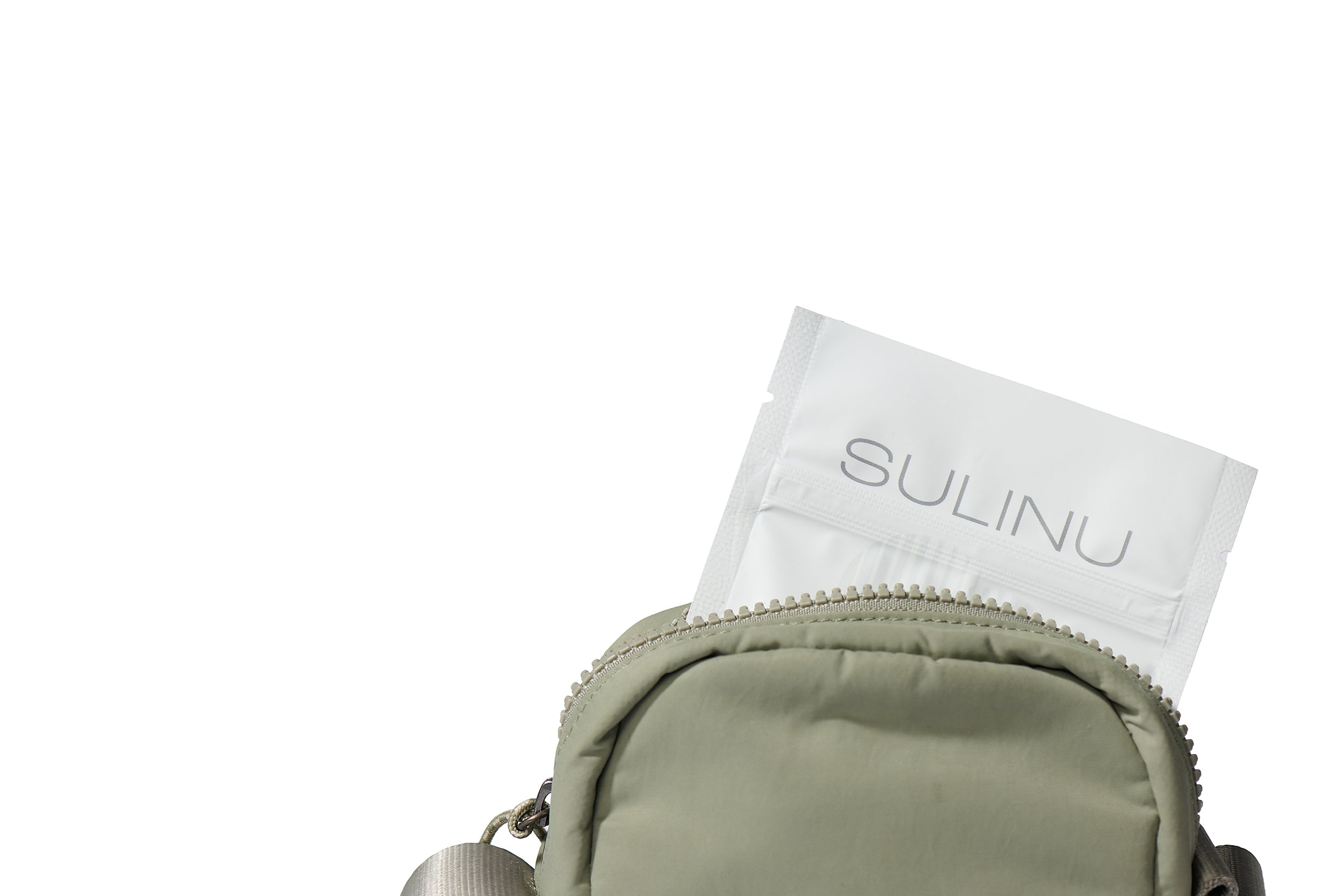 A small gray bag with a partially open zipper reveals The Prep Starter Kit—a white packet essential for healing nutrition—standing out against a plain white background.
