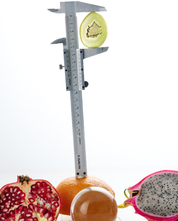 A photo showing fruit being measured by a caliper. Signs of hidden hunger include fatigue, feeling cold, brain fog, and weakness. In addition to post surgery supplements, Sulinu offers  meal plans designed to support wound healing after plastic surgery.