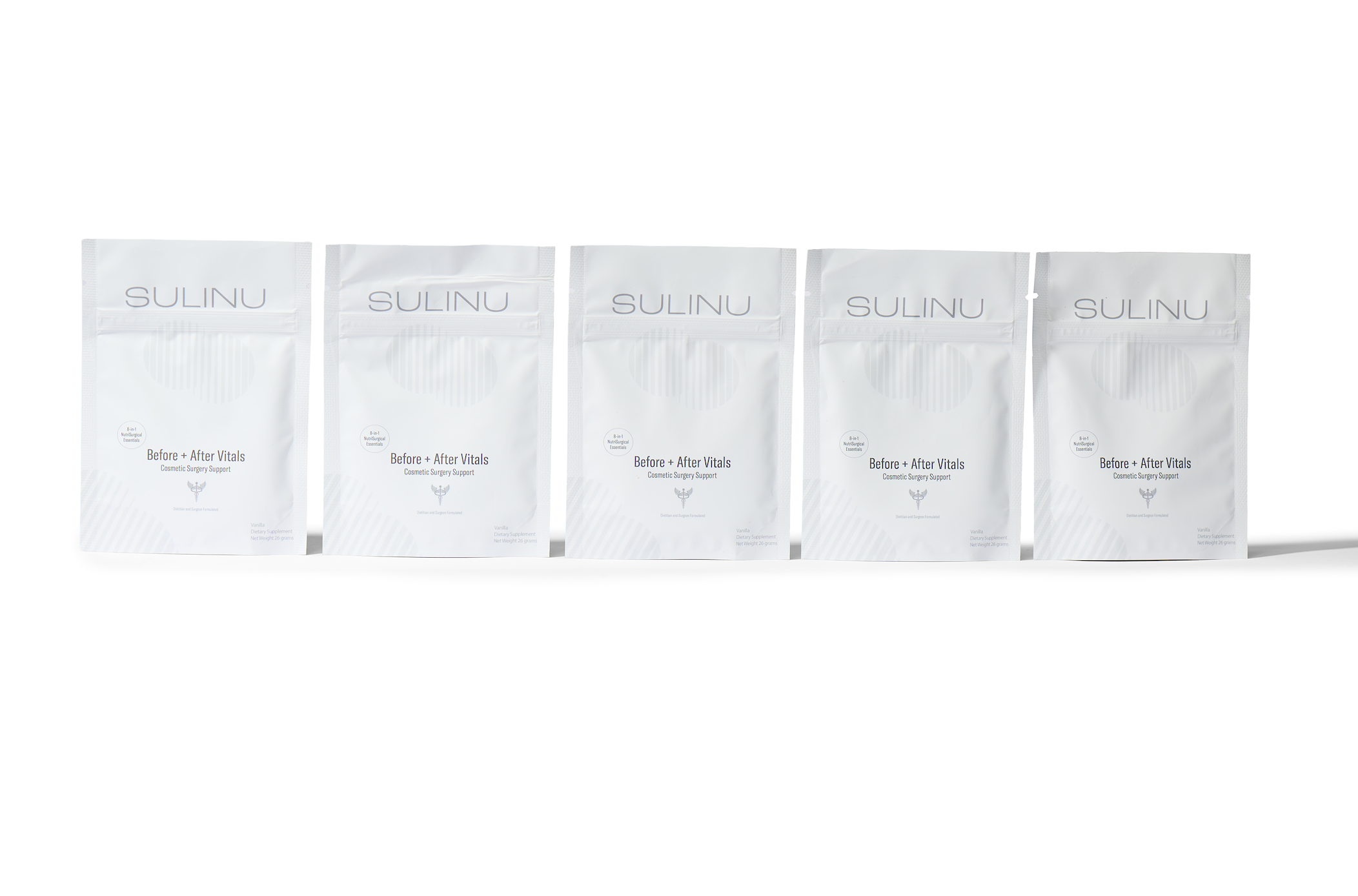 Five white resealable pouches labeled "Travel Packs- Set of 5- Single Serving Before + After Vitals" are displayed in a row on a white background, featuring minimalist packaging with light gray text and subtle line patterns.